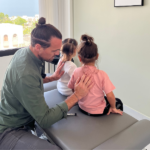 Chiropractor in Oman providing treatment to a patient.